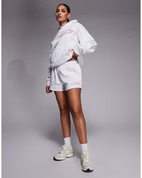 Kaiia - Studio Cotton Rich Printed Logo Sweat Shorts - Lyst