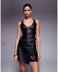 I.AM.GIA - Sibari Faux Leather Plunge Neck Strappy Buckle Detail Racerback Corset Top - Lyst