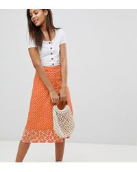 ASOS Jupe mi-longue à pois avec ourlet brodé - Orange