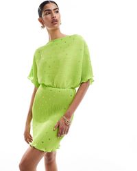 Never Fully Dressed - Vestido corto verde plisado con estampado - Lyst