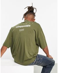 ASOS - T-shirt oversize verde oliva con stampa di città - Lyst