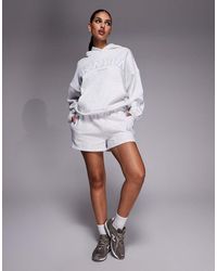 Kaiia - Cotton Rich Embroidered Logo Side Stripe Sweat Shorts - Lyst