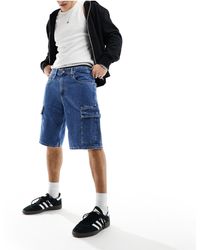 Calvin Klein - Pantaloncini di jeans cargo larghi lavaggio medio anni '90 - Lyst