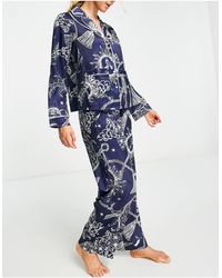 ASOS Damen Kleidung Nachtwäsche Schlafanzüge Premium satin double breasted revere top and slim leg trouser pyjama set in cream tassle print 