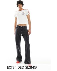 ASOS - Jeans a zampa con fondo ampio slavato - Lyst