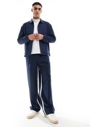 ASOS - Pantalon habillé large d'ensemble à bande latérale blanche - bleu marine - Lyst