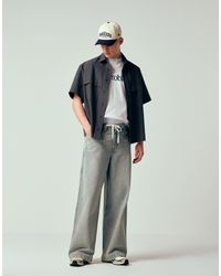 ASOS - Jean baggy extrême clair délavé avec poche arrière brodée - Lyst