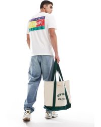Tommy Hilfiger - T-shirt bianca con stampa multicolore del logo sulla schiena - Lyst