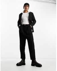 AllSaints - Pace - pantaloni da abito affusolati neri - Lyst