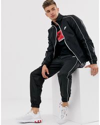 nike woven tracksuit set in black