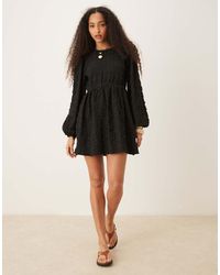 Gina Tricot - Textured Mini Dress With Open Tie Back And Volume Sleeves - Lyst