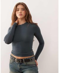 Weekday - Top A Maniche Lunghe Slim Morbidissimo Blu Petrolio Con Fori Per I Pollici - Lyst