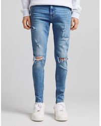 Jeans azzurri ampi con strappiBershka in Denim da Uomo colore Blu | Lyst