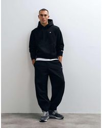 Champion - Core Heritage Pants Barrel Leg Drawstring Trackies - Lyst