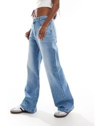 Bershka - Jeans ampi lavaggio chiaro con strass - Lyst