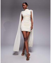 Ruched & Ready - Sculpting Mock Neck Mesh Cape And Twisted Skirt Detailing Mini Dress - Lyst