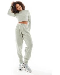 Nike - – phoenix – bouclé-jogginghose - Lyst