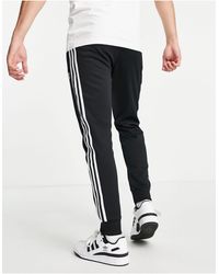 adidas originals adicolor superstar joggers in black
