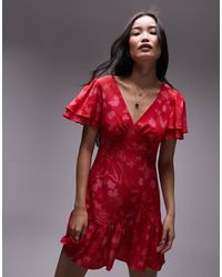 TOPSHOP - Bella - robe à manches ange et imprimé fleurs - rouge et rose - Lyst