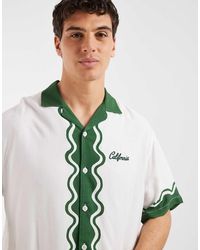 ASOS - Relaxed Revere Shirt With Chest And Border Print - Lyst