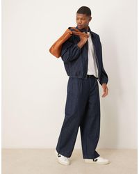 ASOS - Vaqueros De Corte Globo Holgado Con Lavado Medio A Rayas De -Azul - Lyst