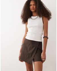 Mango - Mini jupe-short en lin mélangé - Lyst