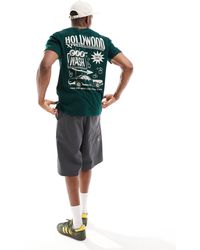 Hollister - Camiseta verde oscuro holgada con estampado en la espalda destination - Lyst