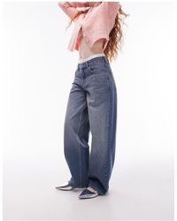 TOPSHOP - Jeans con cinturino sul retro medio - Lyst