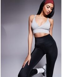 4505 - Light Support Strappy Sports Bra With Adjustable Straps - Lyst