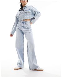 Calvin Klein - Jeans comodi a vita alta lavaggio chiaro - Lyst