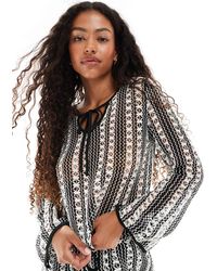 Vero Moda - Top manches longues au crochet d'ensemble à rayures avec liens noués - et blanc - Lyst