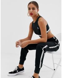 pantaloni rossi converse