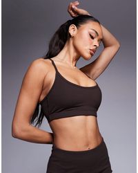 4505 - Icon Light Support Sports Bra With Adjustable Straps - Lyst