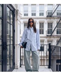 Lioness - Exclusive Chelsea Cotton Oversized Shoulder Pad Detail Shirt With Tie - Lyst
