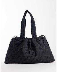 4505 - Woven Logo Quilted Tote With Adjustable Toggle - Lyst