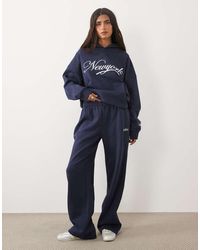 Kaiia - Cotton Rich Embroidered New York Script Logo Wide Leg Sweatpants - Lyst