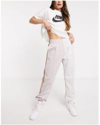 Nike Джоггеры Сероватого Цвета В Стиле Колор Блок С Логотипом-галочкой С Эффектом Металлик -многоцветный