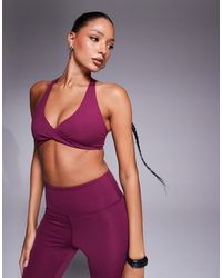 4505 - Light Support Twist Front Sports Bra Mulberry - Lyst
