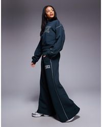 Nike - Retro Logo Wide Leg joggers - Lyst