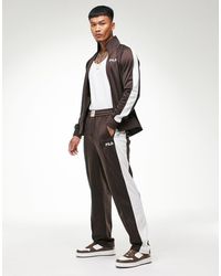 Pantalones de chándal Fila de hombre: hasta el 73 % de descuento | Lyst