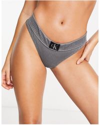 Calvin Klein - Slip bikini a vita alta neri a coste - Lyst
