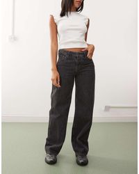 Weekday - Vaqueros Negros Holgados De Talle Bajo Con Lavado Desgastado Ample De - Lyst