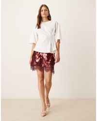 Never Fully Dressed - Minifalda De Lentejuelas Grandes Con Ribete De Encaje Maeva De -Rojo - Lyst