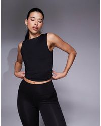 4505 - Icon High Neck Tank With Inner Bra - Lyst