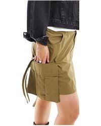 Collusion - Plus Festival Utility Mini Skirt With Drop Pocket And Tab Detail - Lyst