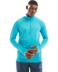 Nike - Stride - top à manches longues et col zippé en tissu dri-fit - turquoise - Lyst
