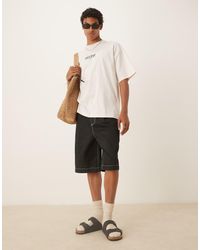 ASOS - Pantalones Cortos Negros De Corte Holgado Extragrande Con Pinzas De - Lyst