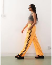 adidas Originals - Pantalones De Chándal Naranjas Y Negros Firebird Loose De - Lyst