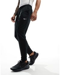 Nike - Totality dri-fit - joggers neri - Lyst