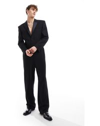 ASOS - Tuta jumpsuit nera stile smoking con spalle squadrate - Lyst